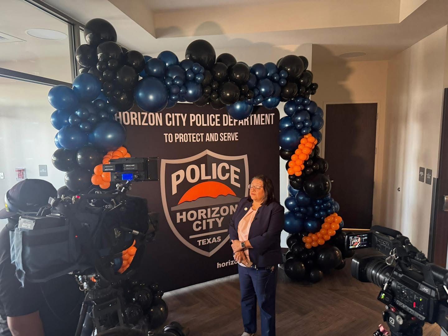 Navy, black and orange balloon arch for a Horizon City Police Department press event