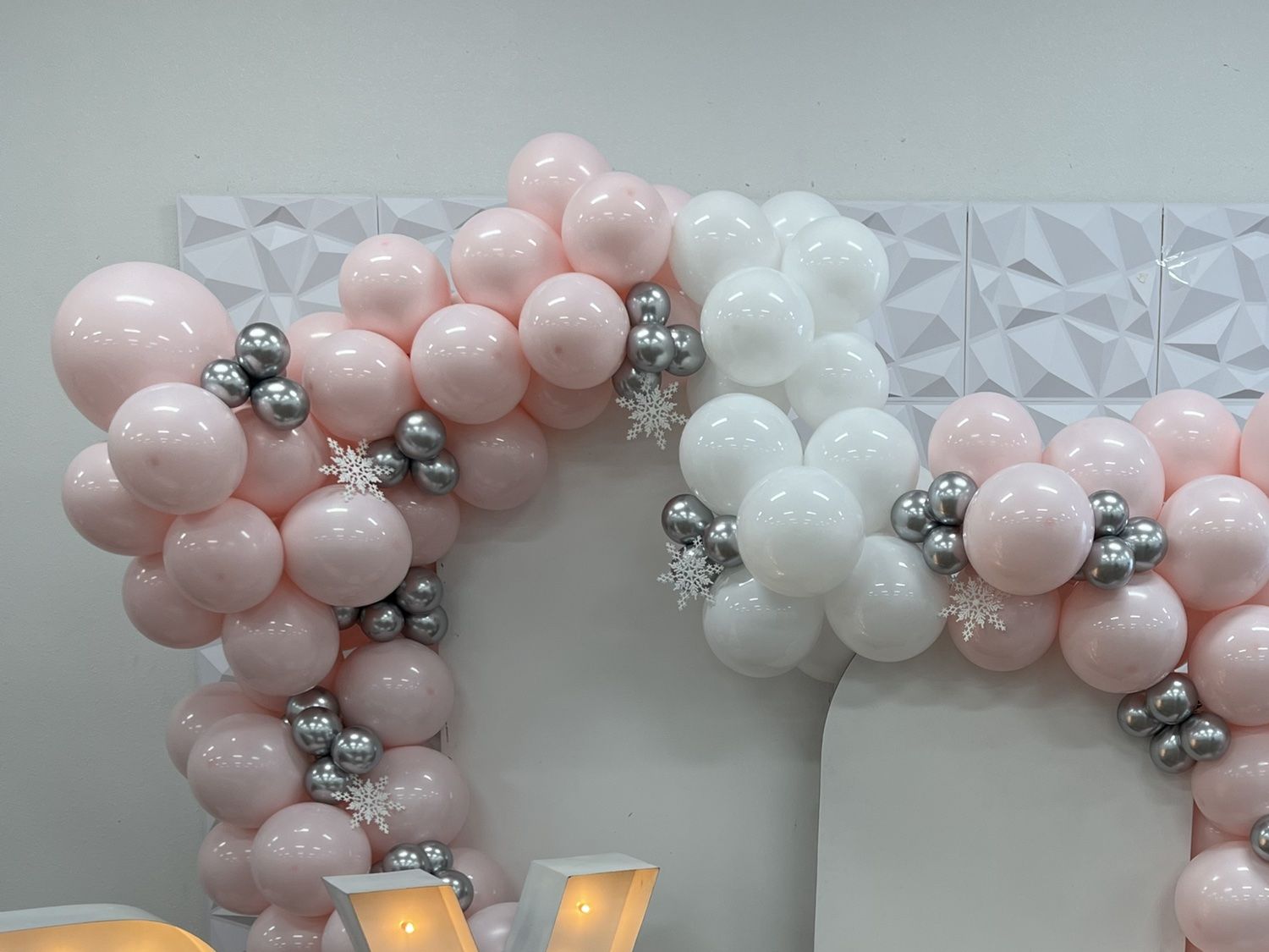 Pink, white and silver balloon garland backdrop by JVR Rentals in El Paso