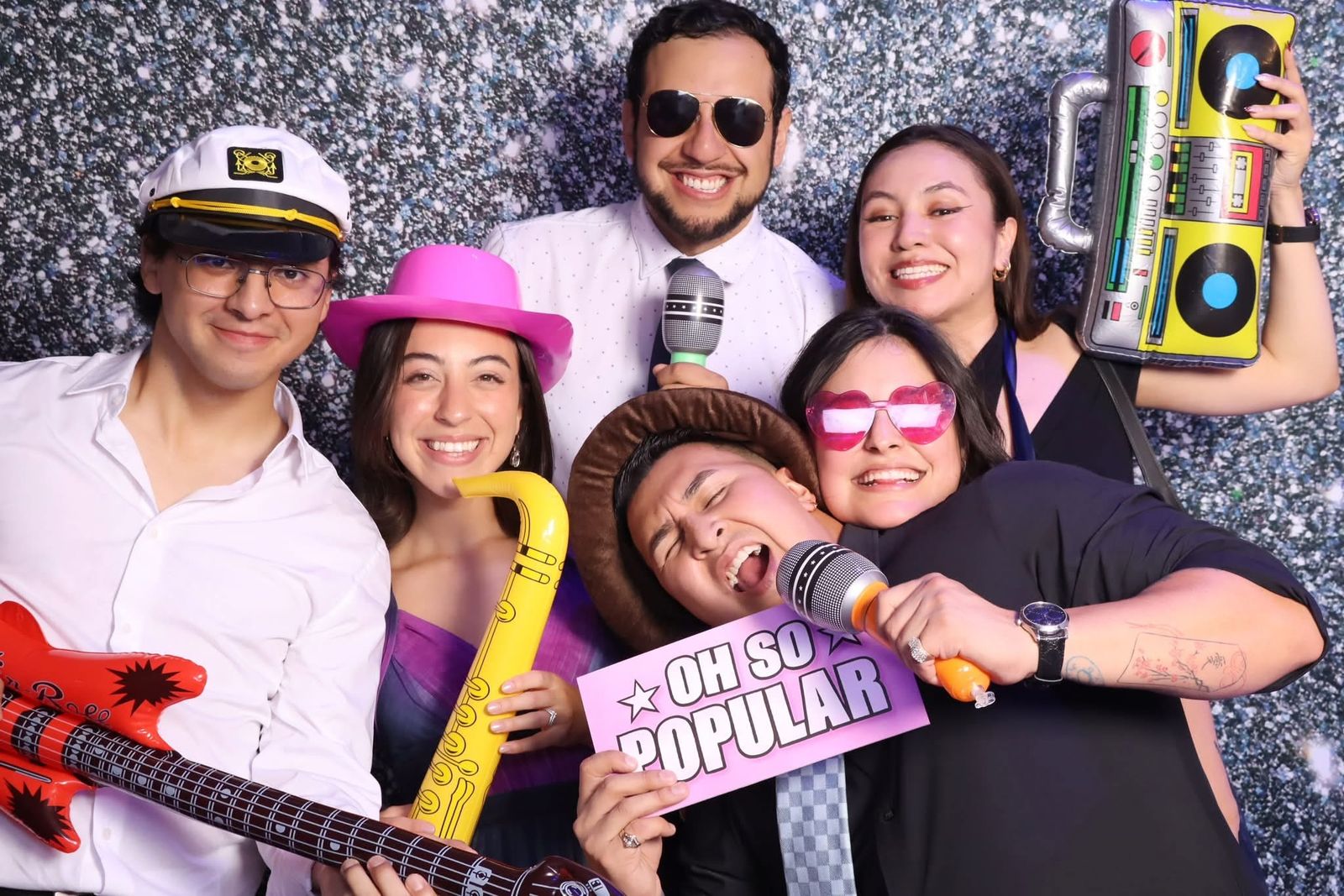 Friends with music props at the JVR photo booth