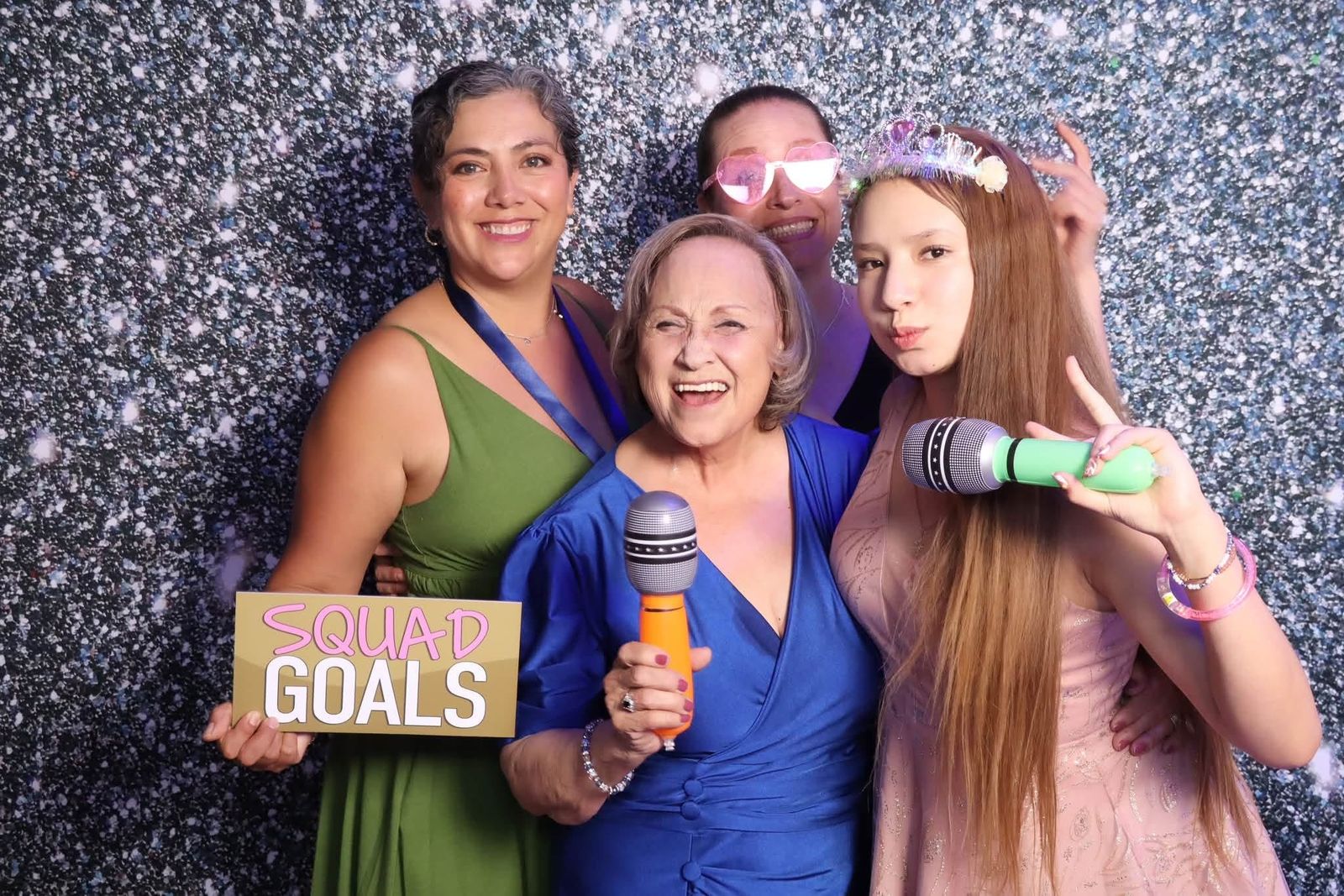 Family with a Squad Goals sign at the JVR photo booth