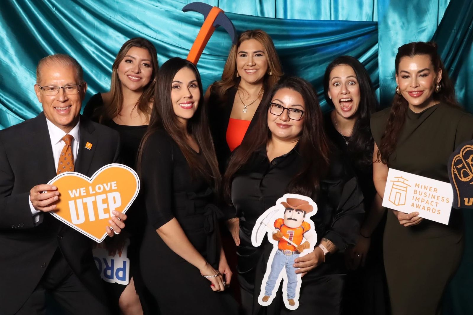 Guests with UTEP props at the JVR photo booth